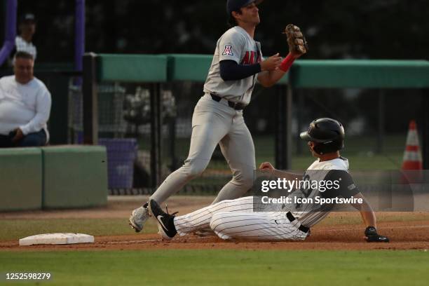 Grand Canyon catcher Tyler Wilson slides into third base against Arizona infielder Tony Bullard during a College Baseball game between the Arizona...