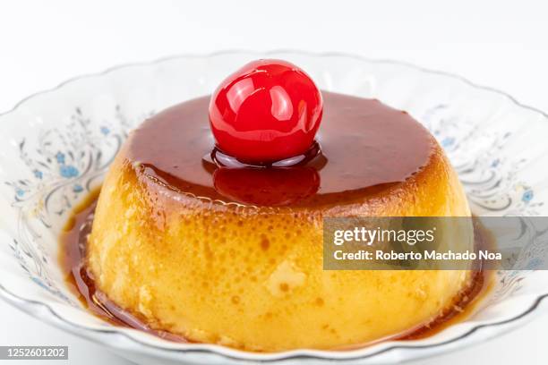 creme caramel dessert with cherry on top - プリン ストックフォトと画像