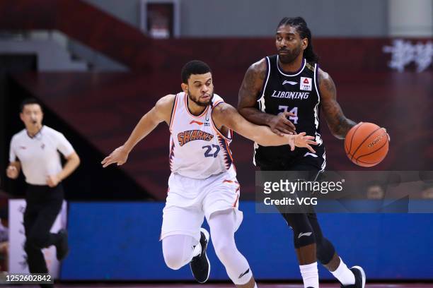 Ray McCallum of Shanghai Sharks and O.J. Mayo of Liaoning Flying Leopards compete for the ball during 2019/2020 Chinese Basketball Association League...