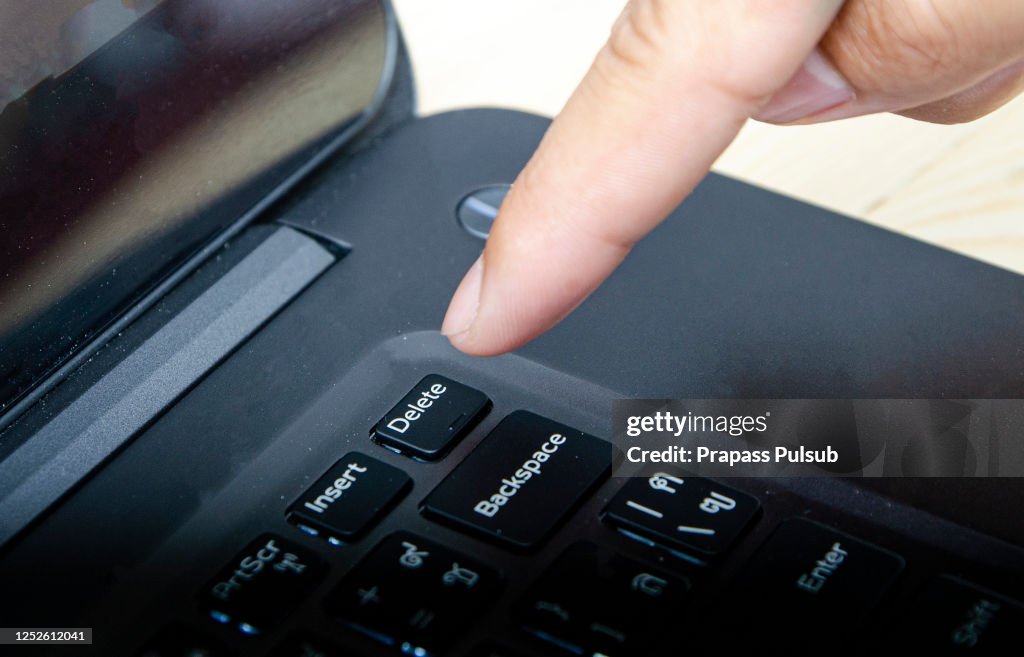 Computer Key Finger Finger Is Pressing Delete Key Of Computer Keyboard High-Res Stock Photo ...