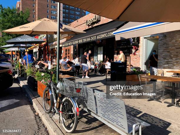 Sidewalk seating for newly reopended, restaurants during Phase 2, socially distanced, in Forest Hills, Queens, New York.