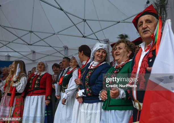 May 2, 2023: Krakow's Small Square comes alive with the vibrant performance of the Folk Group from Uszew of Gmina Gnojnik as they celebrate Polish...