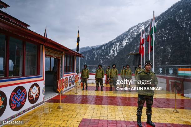 This picture taken on April 5, 2023 shows Indian army soldiers standing at the Jaswant Garh war memorial in the Tawang district of India's Arunachal...