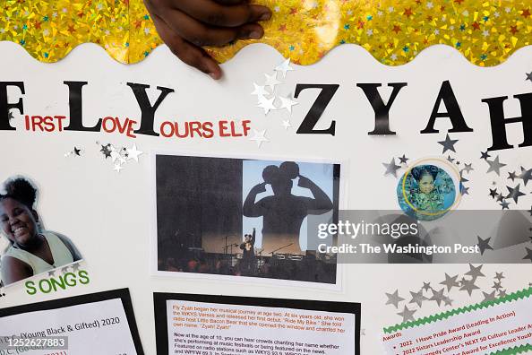Fly Kid The Rapper 11-year-old rapper Fly Zyah holds a poster about her rap journey at ...