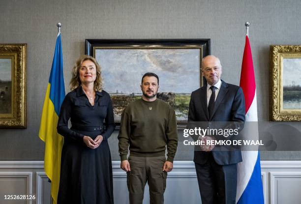 Ukrainian President Volodymyr Zelensky poses next to Dutch Senate president Jan Anthonie Bruijn and Dutch House of Representatives president Vera...