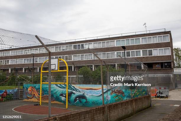 The Portland Street Multi Use Games Area is pictured in front of a Gayhurst housing block at the Aylesbury Estate in Walworth on 27 April 2023 in...