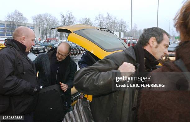 Members of Noir Desir band, drummer Denis Barthe and bassist Jean-Paul Roy arrive 15 march 2004 at Vinius airport. Their lead singer Bertrand Cantat...