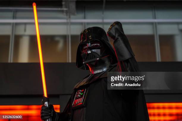 May 04: Star Wars fan cosplaying as Darth Vader holds a light saber pose for photo outside Taipei Performing Arts Center during the May The Fourth...