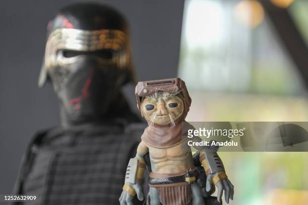 May 04: Star Wars fan cosplaying as Kylo Ren holds a Babu Frik doll pose for photograph outside Taipei Performing Arts Center during the May The...