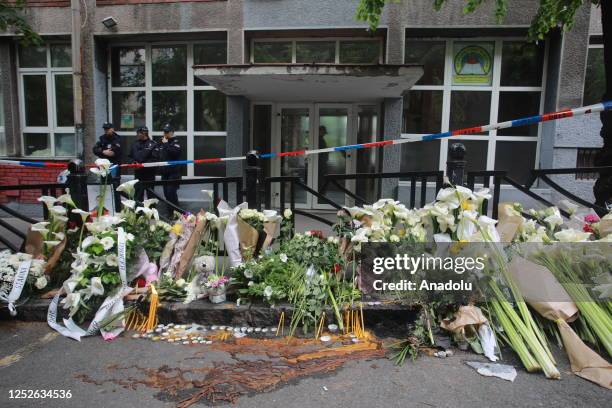 View of flowers that are left to respect the victims of a school shooting that left at least nine people dead at Vladislav Ribnikar Primary School in...