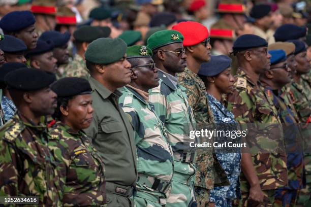 Commonwealth troops wait to receive commemorative coins during a military parade for representatives of the Commonwealth taking part in the...