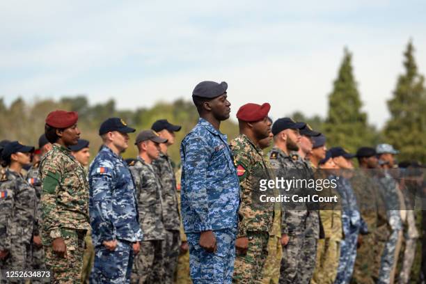 Commonwealth troops wait to receive commemorative coins during a military parade for representatives of the Commonwealth taking part in the...