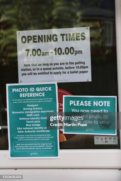 Signs provide assistance with voter ID as voting opens in the local election on May 4, 2023 in Norwich, United Kingdom.