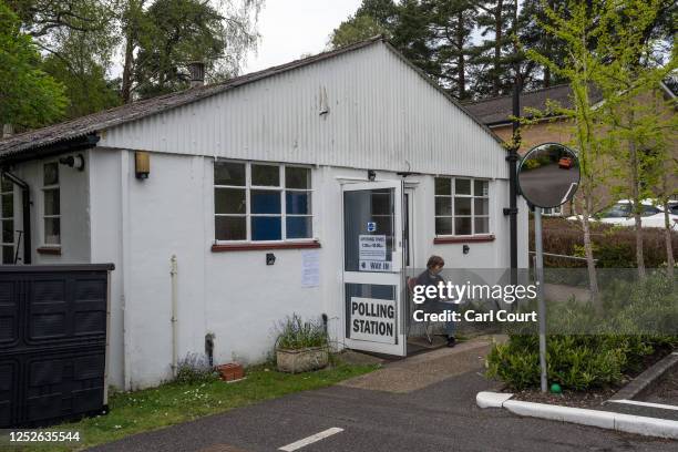 Liberal Democrat Party teller sits outside a polling station during the local elections on May 4, 2023 in Brookwood, United Kingdom.