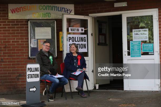 Green and Labour Party tellers sit outside the polling station at Wensum Community Centre as voting opens in the local election on May 4, 2023 in...