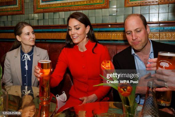 Prince William, Prince of Wales and Catherine, Princess of Wales are served a pint of cider by Bernie Kidson as they chat to local business people as...