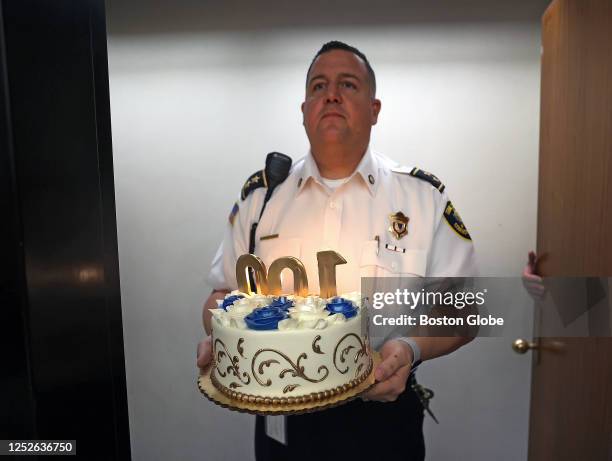 Chief trial court officer Anthony Holmes brought in the lighted birthday cake to the courtroom for the event. Former Lt. Gov. And Attorney General...