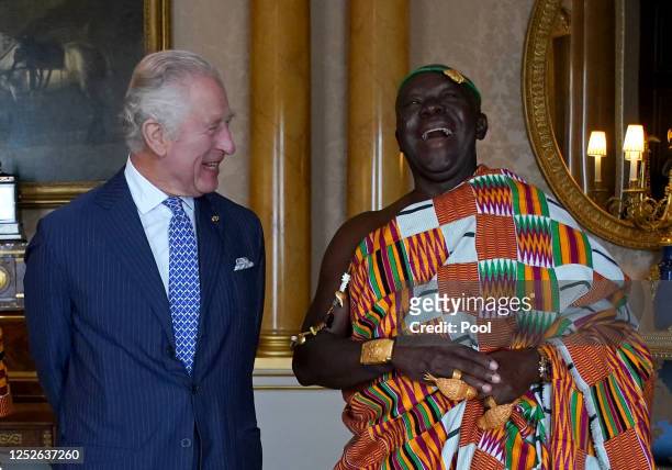 King Charles III receives His Majesty Otumfuo Osei Tutu II, Asantehene, King of the Ashanti Kingdom, during an audience at Buckingham Palace on May...