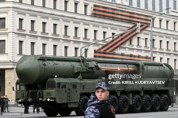 Russian Yars intercontinental ballistic missile launcher moves along the Garden Ring road in front of a huge Z letter, a tactical insignia of Russian...