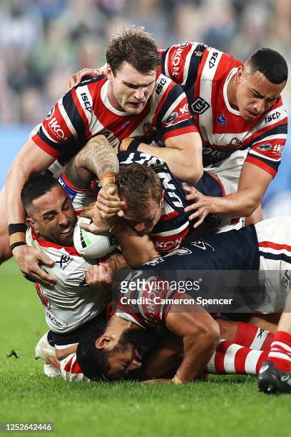 Paul Vaughan of the Dragons is tackled by Angus Crichton, Siosiua Taukeiaho, Jake Friend and Isaac Liu of the Roosters during the round seven NRL...