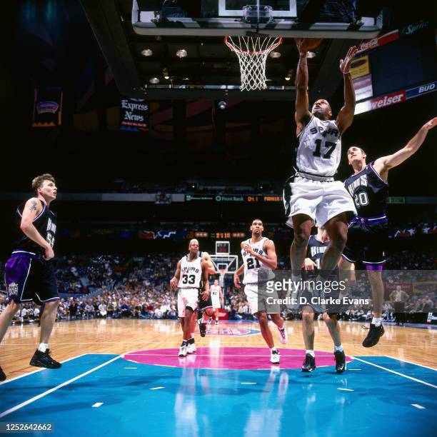 Mario Elie of the San Antonio Spurs shoots against Jon Barry of the Sacramento Kings on February 5, 1999 at the Alamodome in San Antonio, Texas. NOTE...