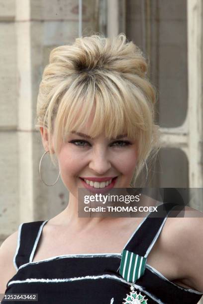 Australian pop star Kylie Minogue smiles after French Culture Minister awarded her as Chevalier of the Order of Arts and Letters on May 5, 2008 in...