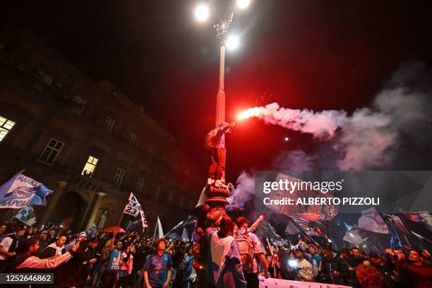 Fans of SSC Napoli gather on May 4, 2023 in Naples, anticipating the celebration of the club's Italian champions "Scudetto" title, as Napoli is...