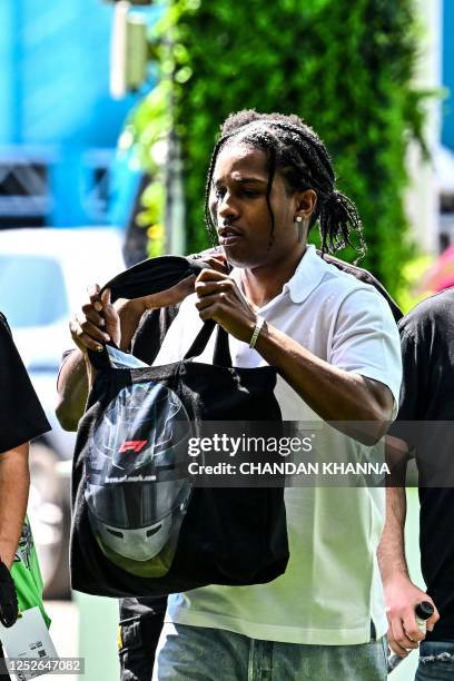 Rapper A$AP Rocky walks in the Paddock at the Miami International Autodrome ahead of the Miami Grand Prix, in Miami Gardens, Florida, on May 4, 2023.