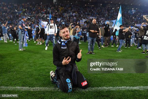 Napoli fans celebrate after the Italian Serie A football match between Udinese and Napoli on May 4, 2023 at the Friuli stadium in Udine. - Napoli...