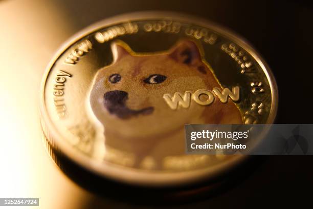 Dogecoin cryptocurrency physical representation is photographed for illustration photo in Krakow, Poland on May 4, 2023.