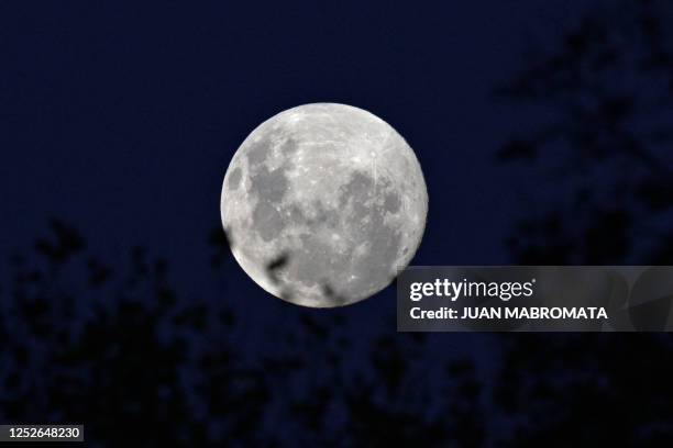 The waxing gibbous moon is seen from the Juan Carmelo Zerillo stadium in La Plata, Buenos Aires Province, on May 4 before the Copa Sudamericana group...