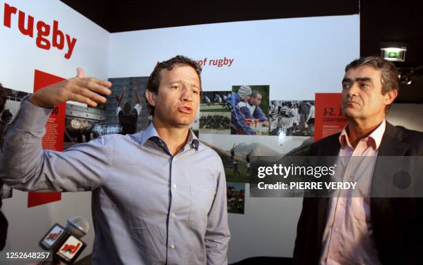 Stade Francais coach and Former France rugby union captain Fabien Galthie speaks to journalists beside French journalist Jacques Verdier at the...