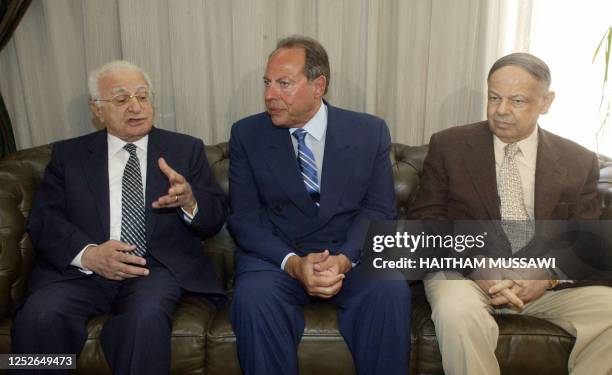 Lebanese President Emile Lahoud sits between Mohamad Baalbaki head of the press syndicate and Melhim Karam, chief of the journalists syndicate, at...