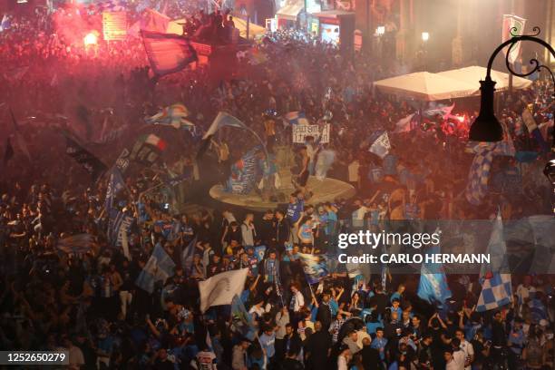 Fans of SSC Napoli celebrate on May 4, 2023 in Naples after Napoli won the Italian champions "Scudetto" title following a decisive match in Udine. -...