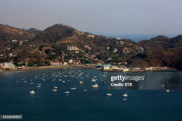 General view of the bay of the Pacific coastal town of San Juan del Sur, Nicaragua, on April 25, 2023. - Drawn to the natural beauty, security and...