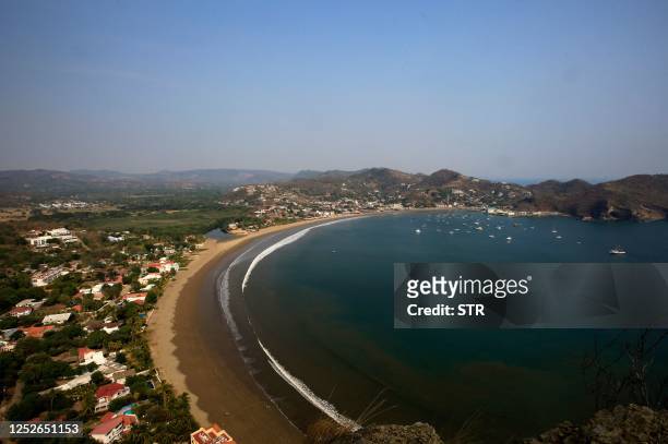 General view of the bay of the Pacific coastal town of San Juan del Sur, Nicaragua, on April 25, 2023. - Drawn to the natural beauty, security and...