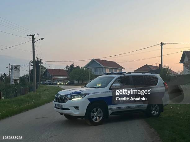 Police officers vehicle block the road after a man opened a fire and at least 10 people were killed and 15 injured in Belgrade, Serbia on May 05,...