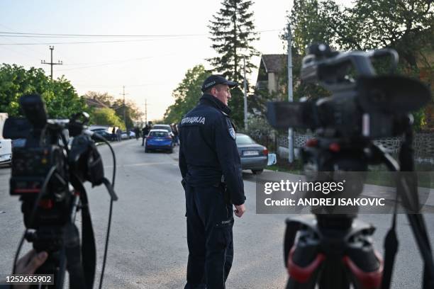 Policeman is seen in the village of Dubona near the town of Mladenovac, about 60 kilometres south of Serbia's capital Belgrade, on May 5 in the...