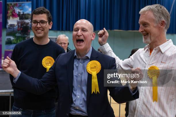 Liberal Democrats Devon Davies , Julian Tisi and Mark Wilson celebrate at the local election count in the Royal Borough of Windsor and Maidenhead...