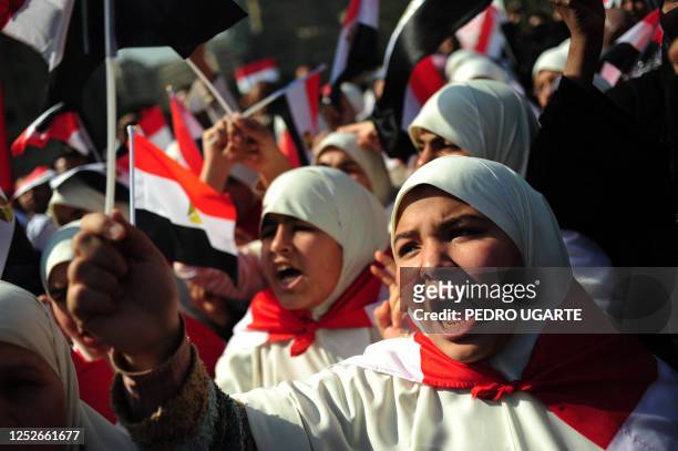 Egyptian women shout slogans in Cairo's Tahrir Square on February 18, 2011 during celebrations marking one week after Egypt's long-time president...