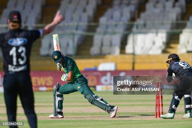 New Zealand's wicketkeeper Tom Blundell sucessfuly stumps out Pakistan's Shan Masood during the fourth One-Day International cricket match between...