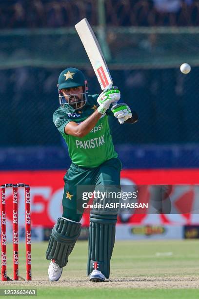 Pakistan's Babar Azam plays a shot during the fourth One-Day International cricket match between Pakistan and New Zealand at the National Stadium in...