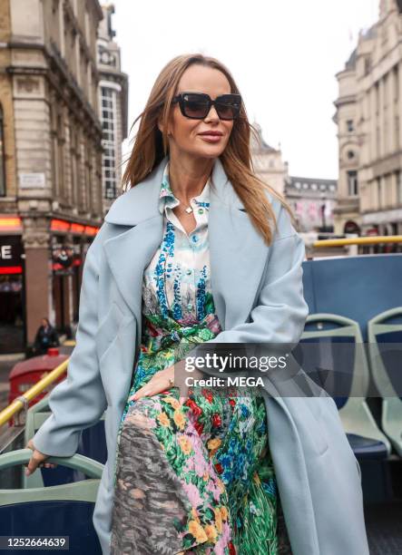 Amanda Holden is seen on a bus ahead of the King's Coronation on May 5, 2023 in London, United Kingdom.