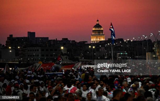 Demonstrators take part in the commemoration of May Day to mark the international day of the workers in Havana on May 5, 2023. - Without the mass...