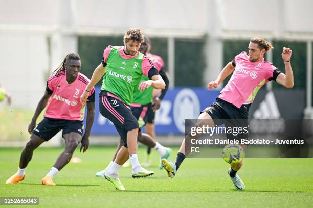 Manuel Locatelli, Adrien Rabiot of Juventus during a training session at JTC on May 5, 2023 in Turin, Italy.