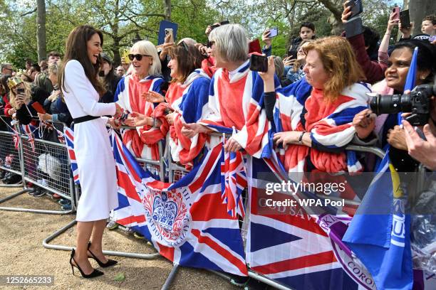 Catherine, Princess of Wales, meets well-wishers during a walkabout on the Mall outside Buckingham Palace ahead of the coronation of Britain's King...