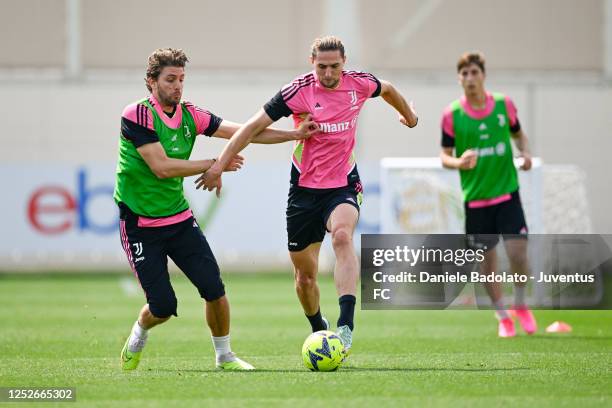 Manuel Locatelli, Adrien Rabiot of Juventus during a training session at JTC on May 5, 2023 in Turin, Italy.