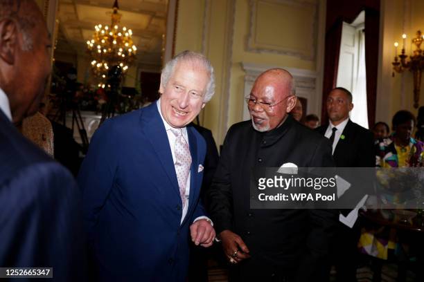 King Charles III reacts at an informal meeting with Commonwealth Leaders at Marlborough House on May 5, 2023 London, England.