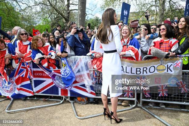 Catherine, Princess of Wales, meets well-wishers during a walkabout on the Mall outside Buckingham Palace ahead of the coronation of Britain's King...