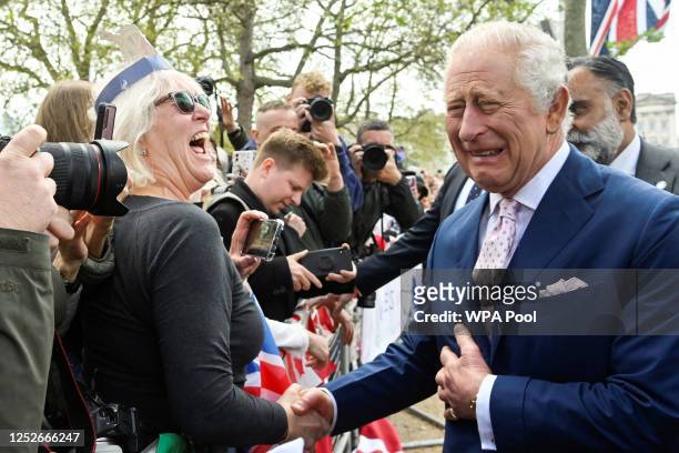 King Charles III meets well-wishers during a walkabout on the Mall outside Buckingham Palace ahead of his and Camilla, Queen Consort's coronationon...